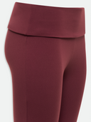 Maroon leggings on a white background

