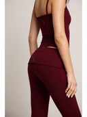 Maroon leggings on a white background

