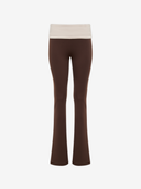Brown flared pants with a tan waistband on a white background

